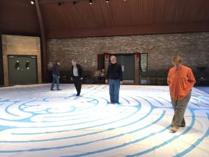 Rev Dee and congregants walking the labyrinth